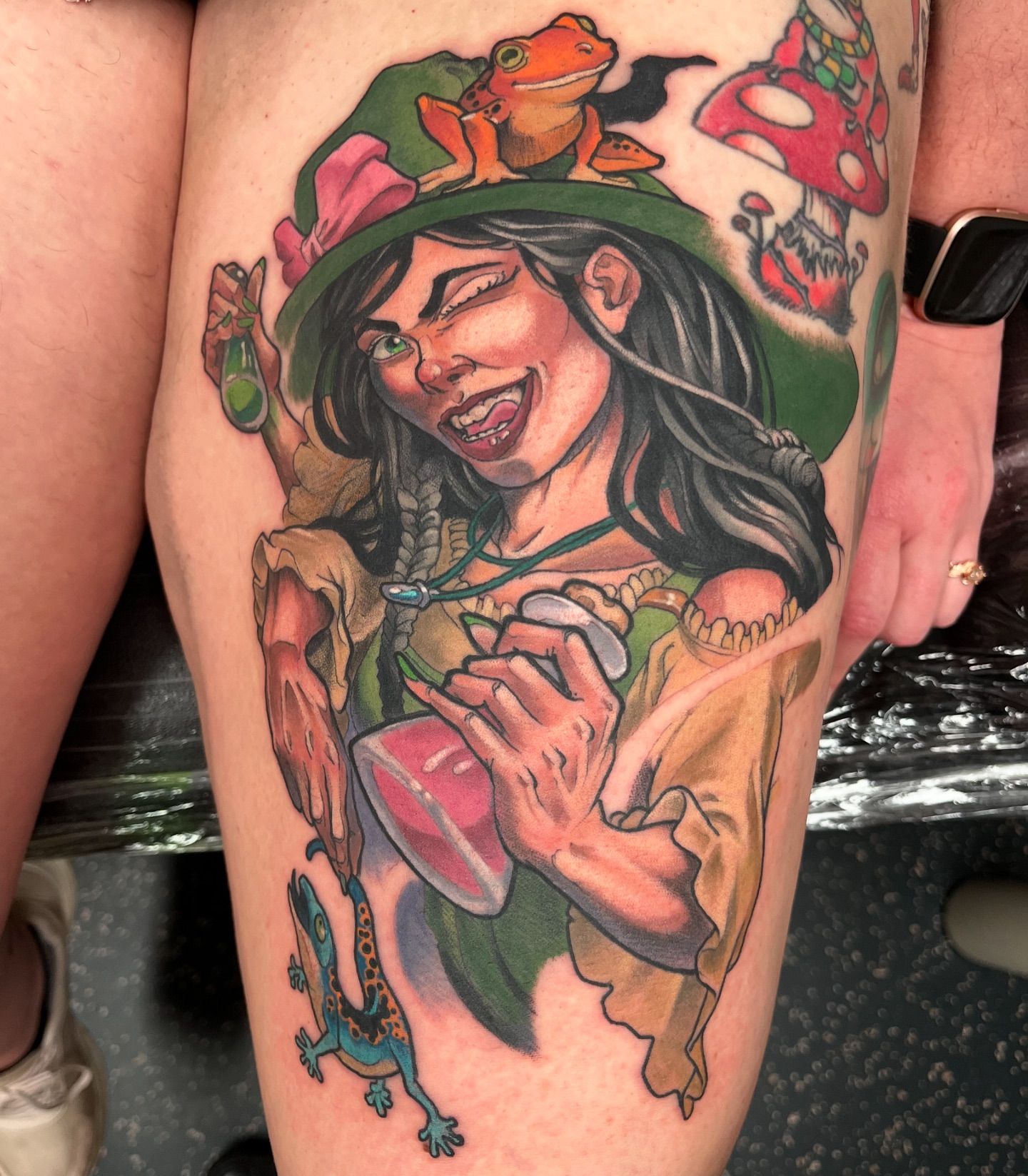 Custom witch character tattoo with frogs illustrative style