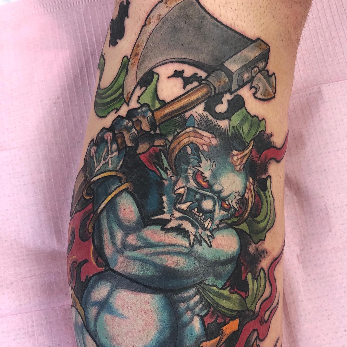 Blue oni demon with axe Japanese style tattoo